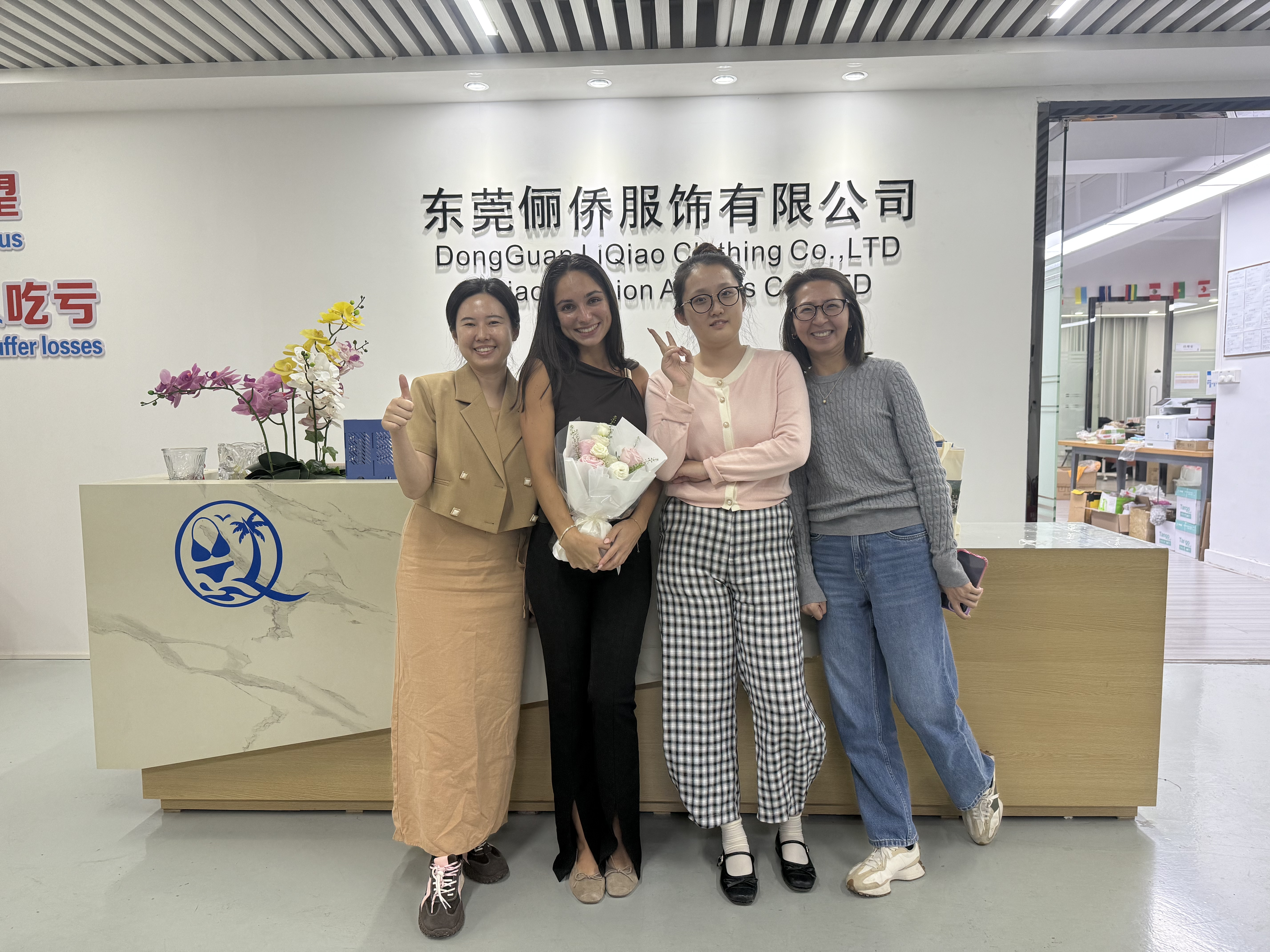 Liqiao team and a customer at the company reception